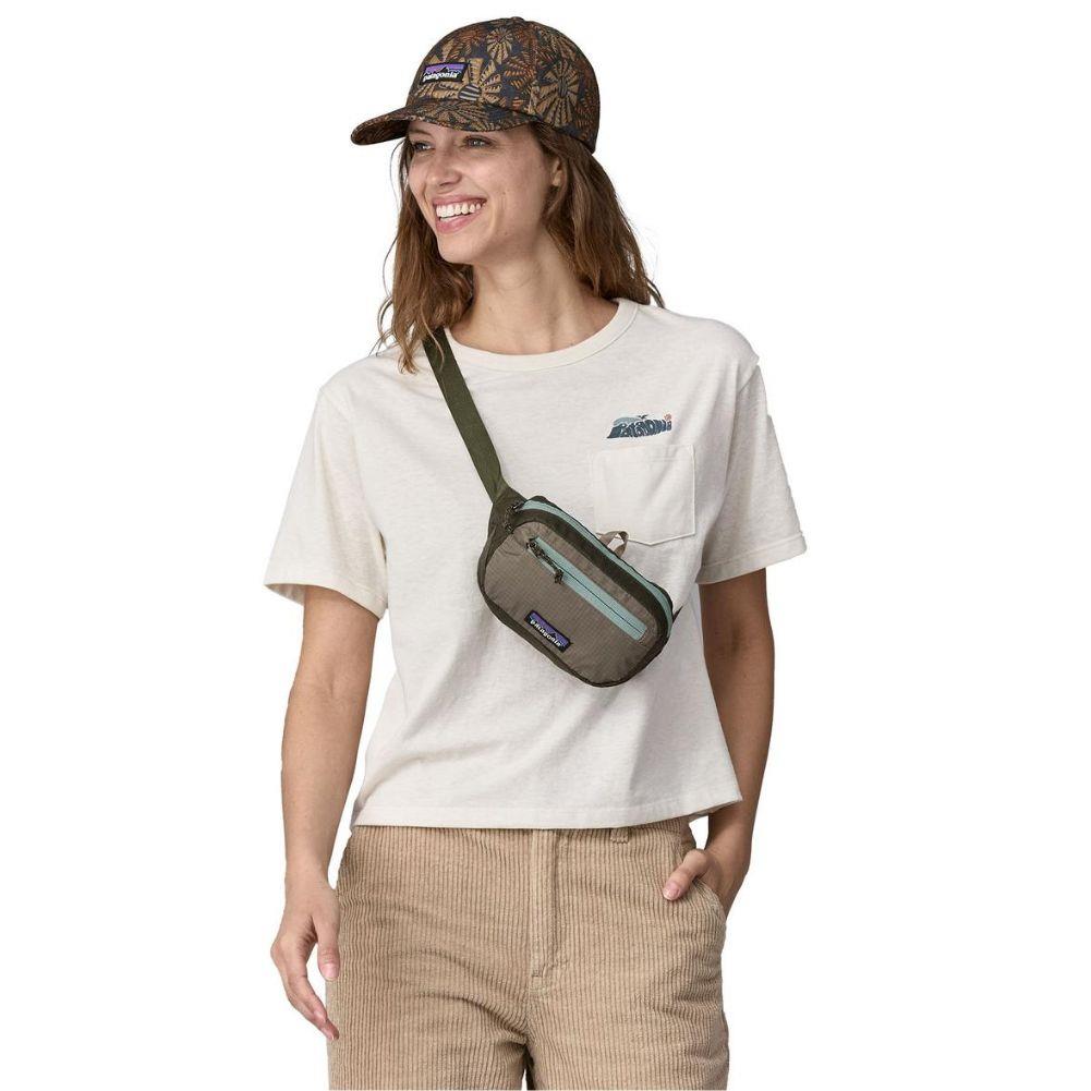 Patagonia Ultralight Black Hole Mini Hip Pack 1L (Pine Needle Green) woman model
