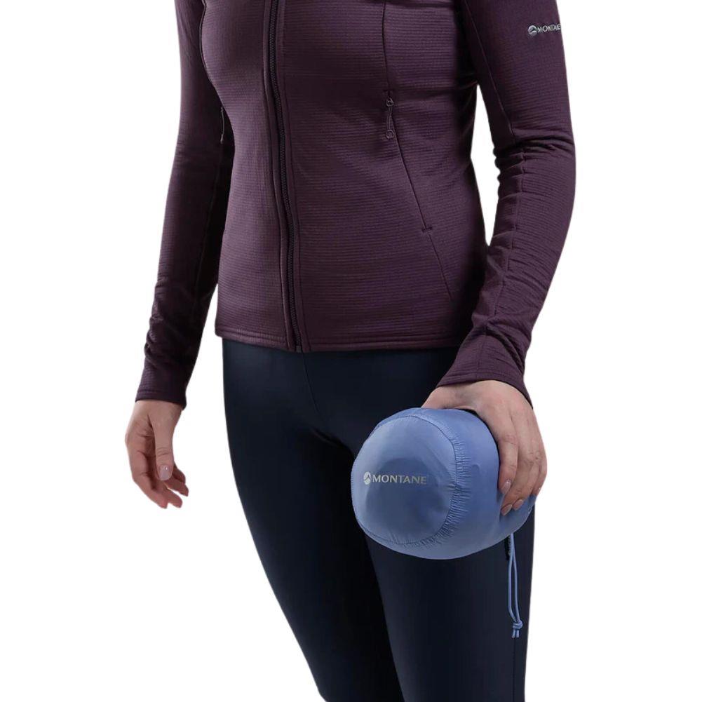 Montane Women&#39;s Anti-Freeze Hooded Down Jacket (Cornflower) rolled up in hand