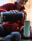 Yeti Rambler 46 OZ Bottle With Chug Cap (Navy) pouring