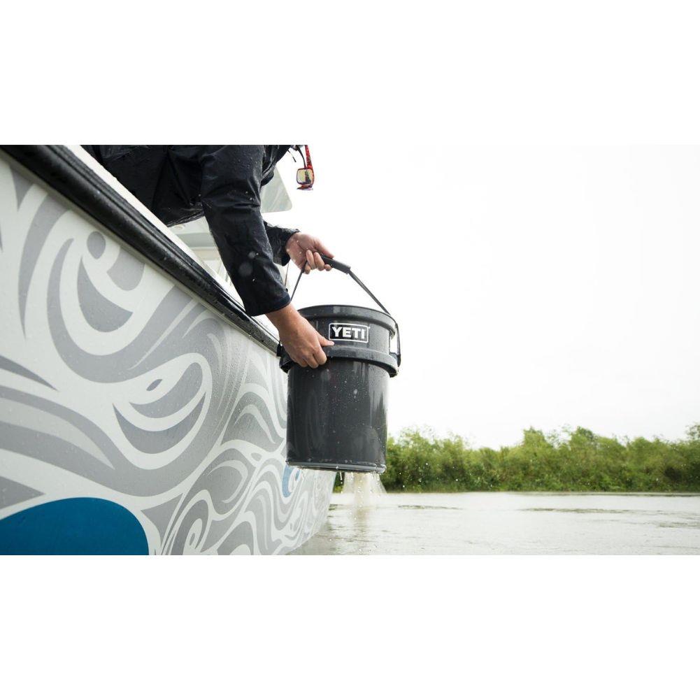 Yeti Loadout 5 Gallon Bucket (Charcoal) scooping water