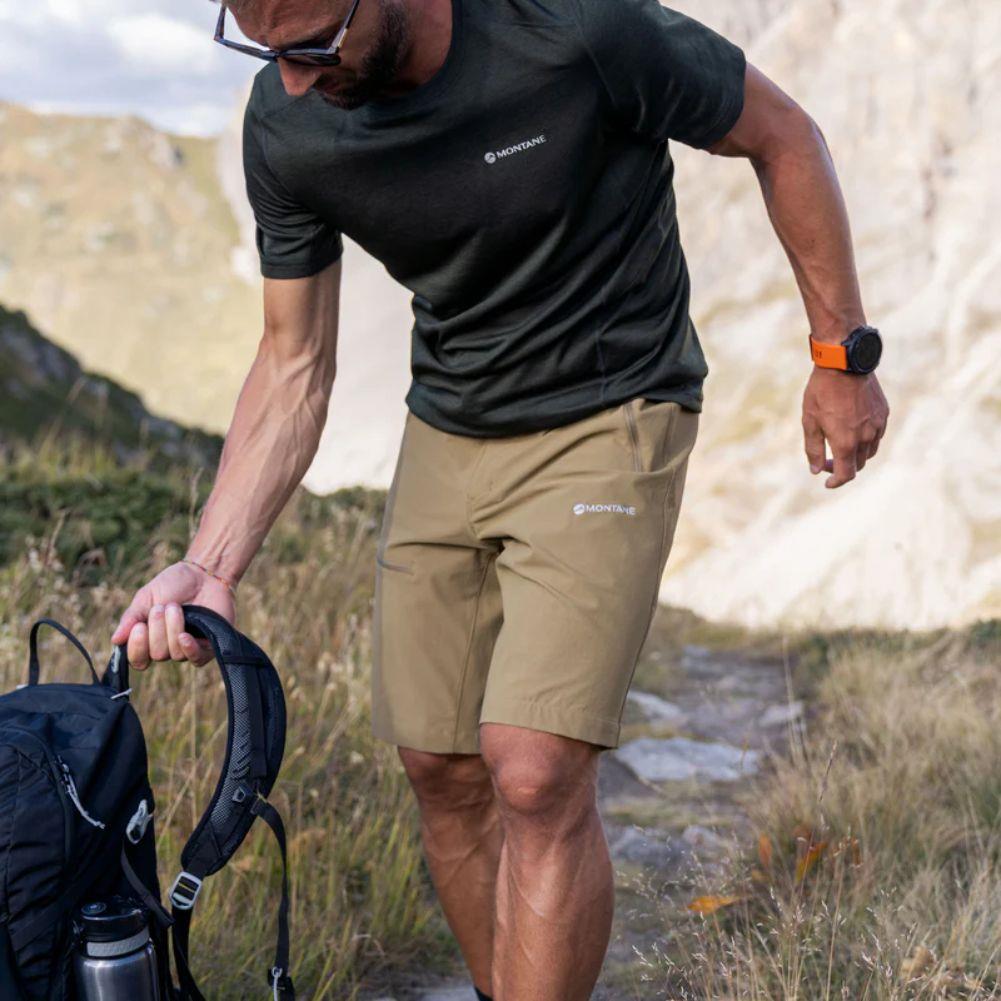 Montane Men&#39;s Tenacity Hiking Shorts (Olive) picking up bag