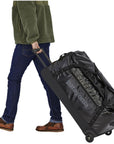 Patagonia Black Hole Wheeled Duffel 100L (Black) walking
