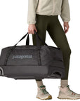 Patagonia Black Hole Wheeled Duffel 70L (Black) holding