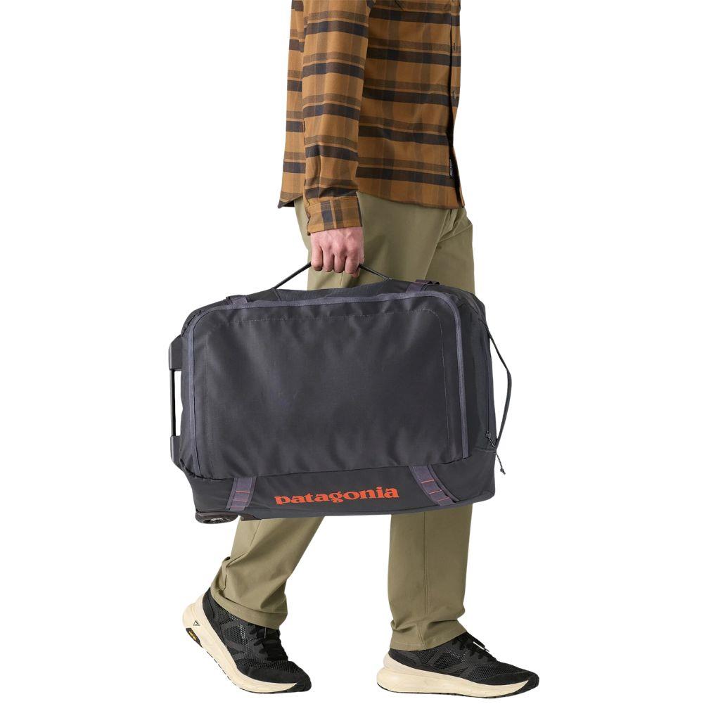 Patagonia Black Hole Wheeled Duffel 40L (Smolder Blue) walking holding