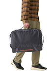 Patagonia Black Hole Wheeled Duffel 40L (Smolder Blue) walking holding