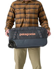 Patagonia Black Hole Wheeled Duffel 40L (Smolder Blue) holding either side