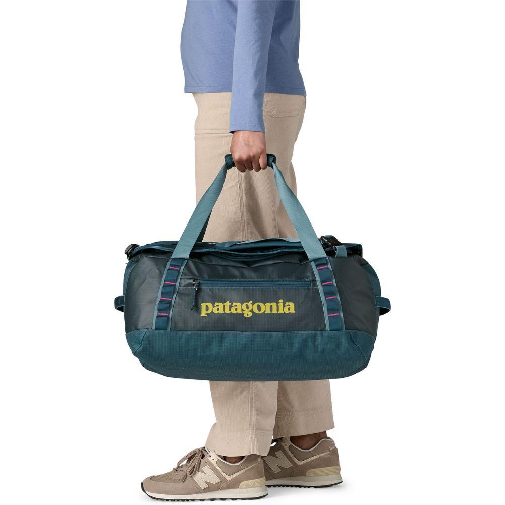 Patagonia Black Hole Duffel 40L (Tidal Teal w/Luminous Pink) holding