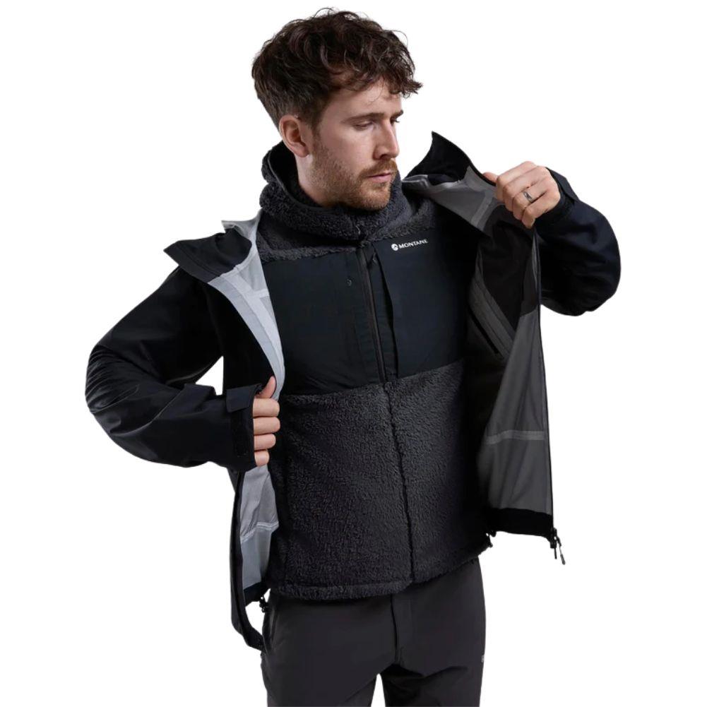 Montane Men&#39;s Caldus XT Hooded Fleece Jacket (Midnight Grey) putting on jacket