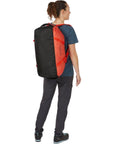 Rab Escape Kit Bag LT 30 (Red Grapefruit) woman back showing