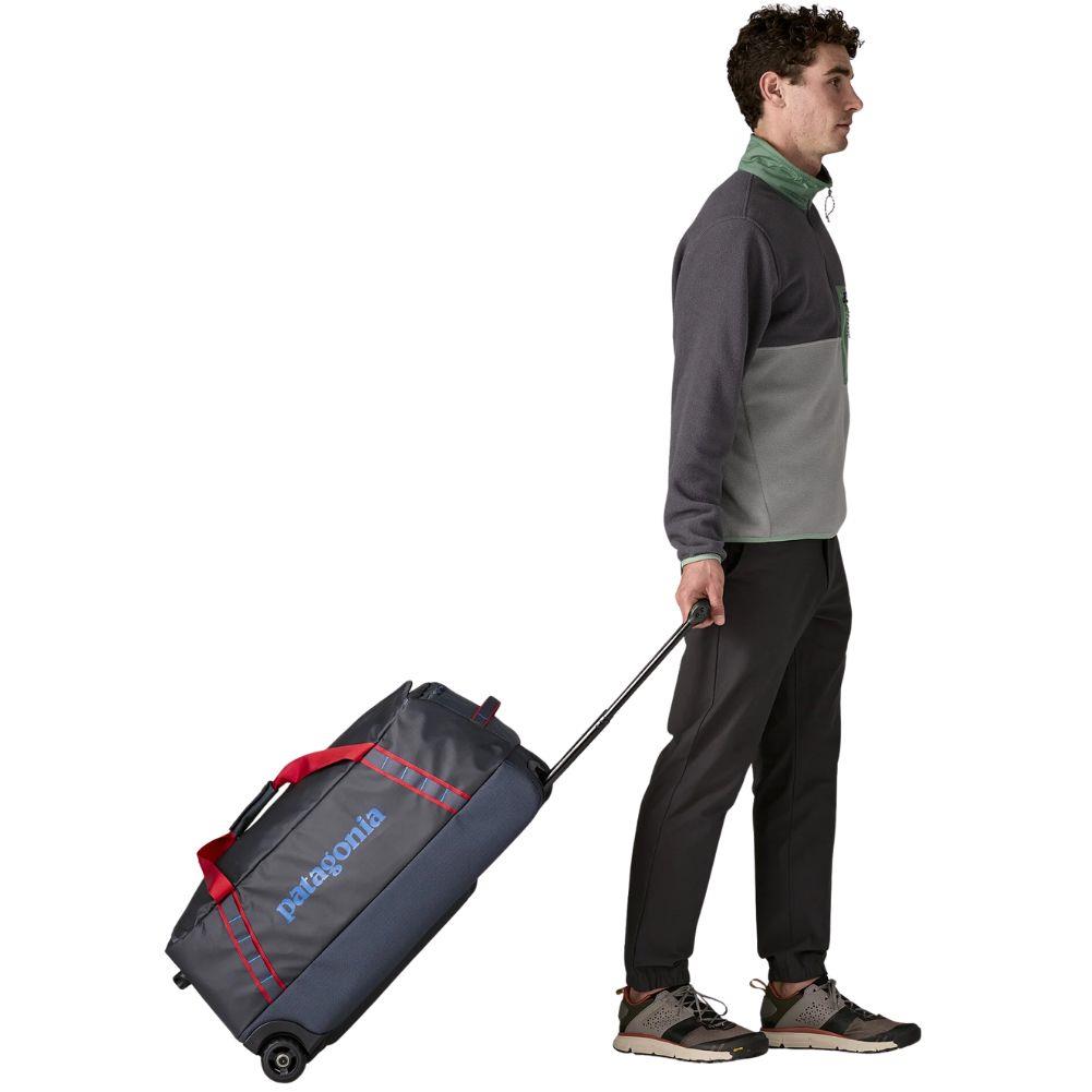 Patagonia Black Hole Wheeled Duffel 70L (Smolder Blue w/Amanita Red) walking