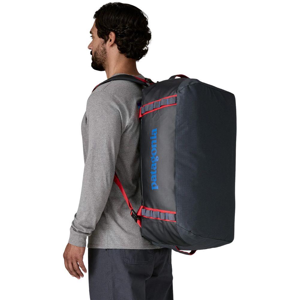 Patagonia Black Hole 55L Duffel Bag (Smolder Blue w/Amanita Red) person